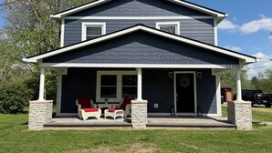 A two-story house with a covered porch, stone pillars, and a mailbox. - 7 mi to Grand Park, 1 mi to Mustard Seed, 5 min to downtown Noblesville! (Noblesville)