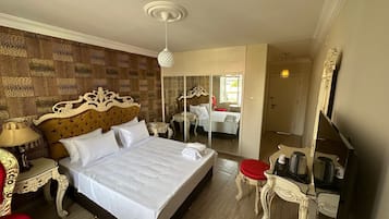 Ropa de cama de alta calidad, minibar, caja fuerte y escritorio