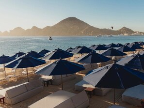 On the beach, sun-loungers