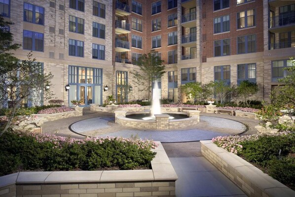 Stunning courtyard with a circular water feature and beautifully landscaped gardens.