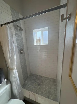 Shower, hair dryer, towels, soap