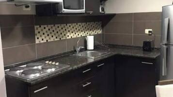 Fridge, microwave, stovetop, coffee/tea maker