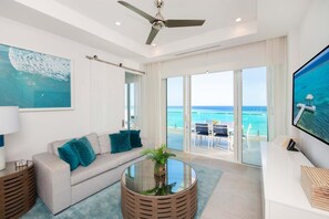 Basic House, Multiple Beds, Pool Access, Ocean View (#407) | Living area | 75-inch TV with cable channels - Rum Point Club (North Side)