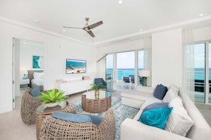 Basic Condo, Multiple Beds, Pool Access, Ocean View (#401) | Living area | 75-inch TV with cable channels - Rum Point Club (North Side)