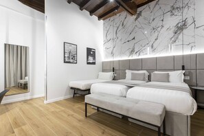 Premium bedding, down comforters, pillowtop beds, free minibar