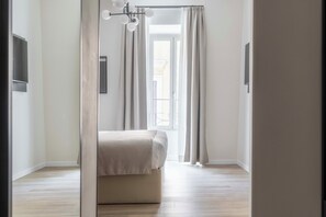 Premium bedding, down comforters, pillowtop beds, free minibar