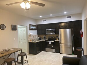 Family House | Private kitchen | Full-size fridge, microwave, oven, stovetop - T&G Vacation Property (Aransas Pass)
