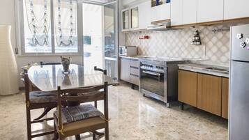 Fridge, oven, dining tables