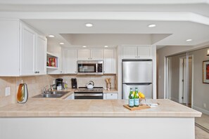 Condo, 1 Bedroom (PKD-104) | Private kitchen | Fridge, microwave, oven, coffee/tea maker