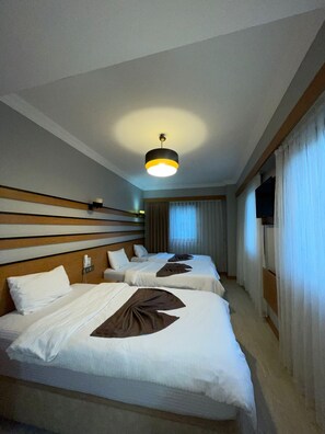 Standard Triple Room | Living area | 75-inch LCD TV with satellite channels, TV - Quars Garden Hotel (Düzce)