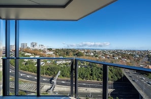 Enjoy unobstructed views of the city from this high-rise building's glass facade.