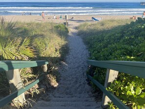 A beach path leading to the ocean with people and beach chairs. - Florida Boho -1 Bedroom Cottage (Lake Worth)