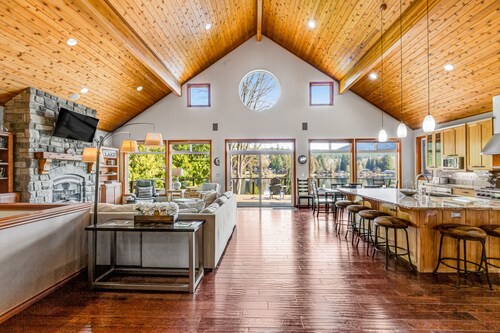 Custom lakefront gem with private dock, hot tub, firepit, & chef's kitchen