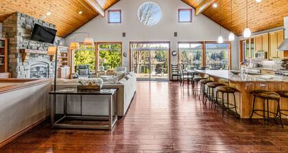 Custom lakefront gem with private dock, hot tub, firepit, & chef's kitchen