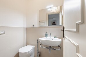 Bathtub, hair dryer, bidet