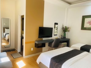 Family Twin Room | Minibar, individually decorated, individually furnished, desk