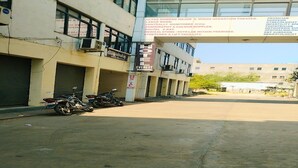 A hotel named Everest with a signboard listing amenities like a modern operation theater, medical store, and path lab. - Everest Hotel  (Sanand)