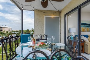 Enjoy a partial view of the bay from the screened balcony.