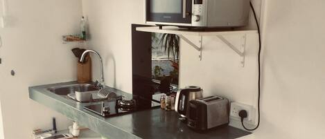 Fridge, microwave, stovetop, coffee/tea maker