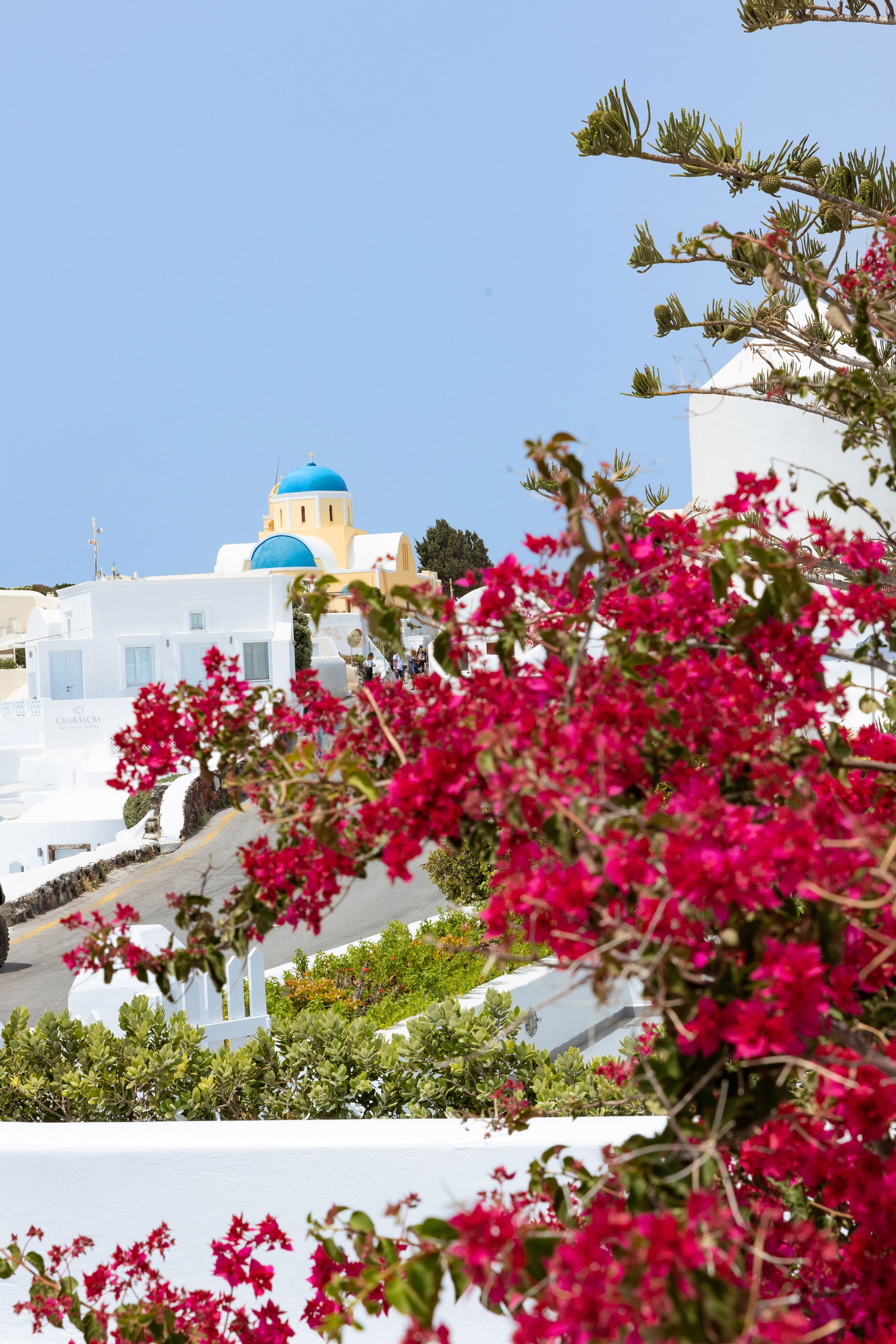 A coastal view with white buildings and blue domes, likely a hotel or resort.