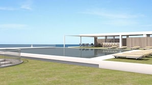 A modern outdoor pool area with a covered seating area and lounge chairs. - Eco Dome Crete (Agios Nikolaos)
