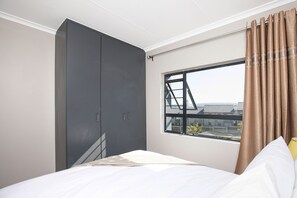 Departamento ejecutivo | 2 habitaciones, espacio para trabajar con laptop y cortinas blackout
