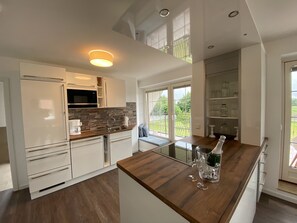 Dishwasher, high chair, dining tables