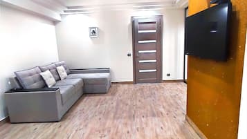Standard Apartment, 1 Queen Bed with Sofa bed, Kitchen | Living area | 55-inch Smart TV with cable channels, TV