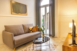 Apartment, 1 Bedroom, Terrace, Ground Floor | Living area | TV - Feelathome San Lorenzo Apartments (Seville)