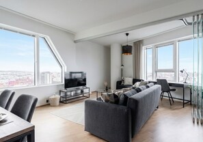 Appartement exclusif | Aire de séjour | Téléviseur à écran plat de 40 po avec télévision par câble, téléviseur