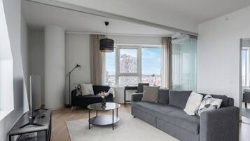 Exclusive Apartment | Living area | 40-inch flat-screen TV with cable channels, TV, heated floors