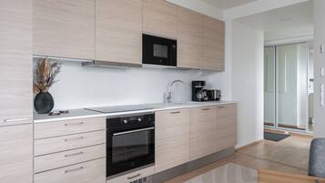 Exclusive Apartment | Private kitchen | Full-sized fridge, microwave, oven, stovetop