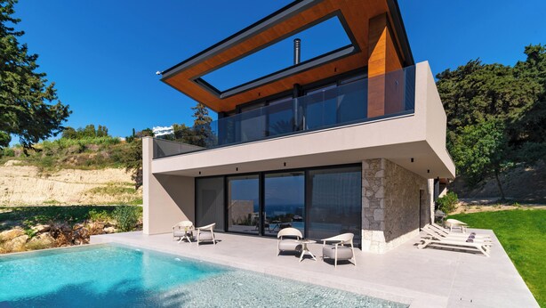 A modern two-story house with a swimming pool, large glass windows, and a stone facade. - Casa Palmera, Casa Palmera (Rhodes)