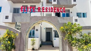 A modern building with the sign "ELITE RESIDENCE" above the entrance. - Elite Residence (Dahab)