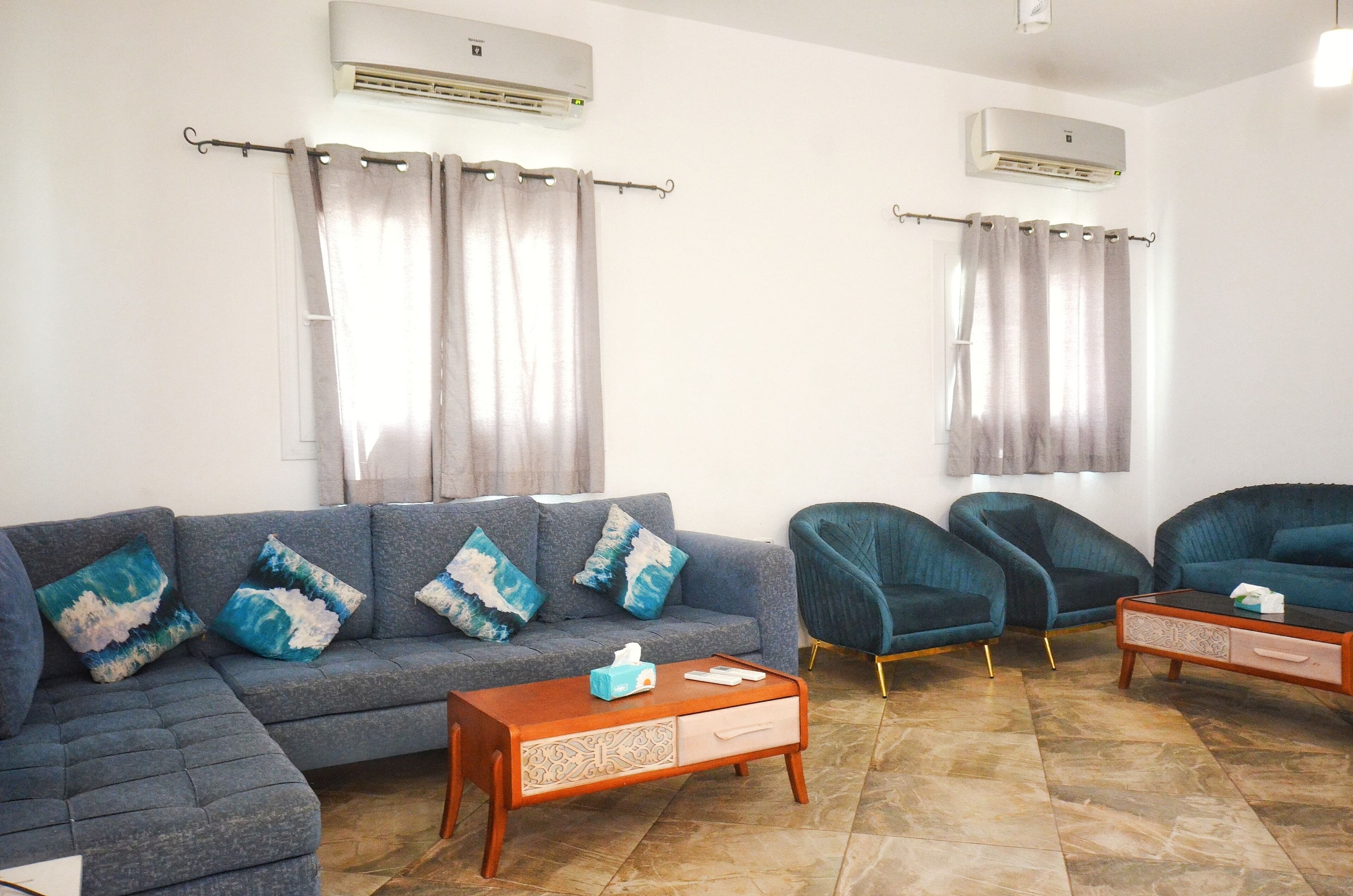 Deluxe Villa | Living area | 55-inch flat-screen TV with cable channels, fireplace