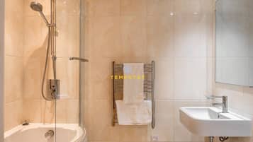 Bathtub, hair dryer, towels