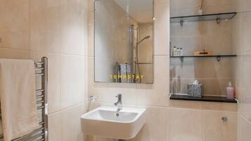 Bathtub, hair dryer, towels