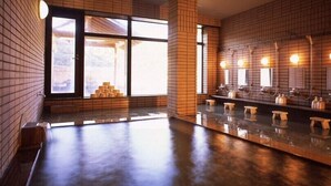 A modern bathroom with a large window, a wet floor, and multiple sinks with mirrors. - Hijiori Onsen Kangetsu (Okura)