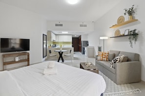 Apartment (1 Bedroom) | Living area | 50-cm plasma TV with satellite channels - Luxury Sea View 1B Apartment in RAK (Ras Al Khaimah)