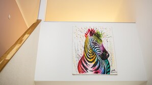 A painting of a zebra on a white wall. - happy home Budapest PINK   Central located apartment with 80  039 s pinball machine (Budapest)