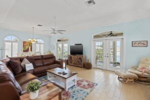TV, offices - Stunning Coastal Home with Pool, Steps to Beach (Fort Myers Beach)