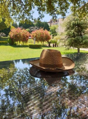 Relax amidst lush greenery and serene water views.