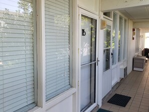 Building 15 features a tiled entrance with a small vent.