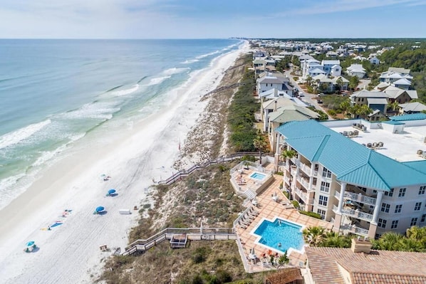 A coastal hotel with a swimming pool, beach access, and beachfront views. - Seasonal Beach service, beachside pool, balcony with nature views, 30A (Santa Rosa Beach)