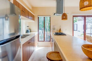 Fridge, microwave, stovetop, coffee/tea maker