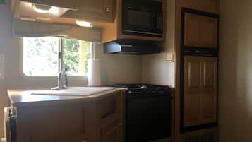 Fridge, microwave, stovetop, coffee/tea maker