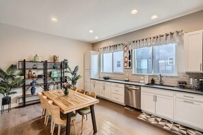 Fridge, microwave, oven, stovetop - Stylish & Spacious Pet-Friendly Home 10 Mins to Downtown w/Garage & EV Charger! (Wheat Ridge)