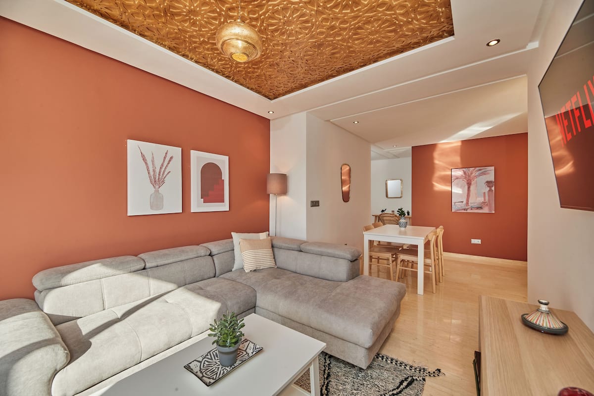 Royal Apartment | Living area | 45-inch Smart TV with satellite channels, TV, offices