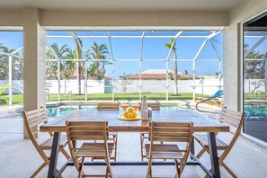 Outdoor dining - Spacious 4 Bedroom 2 Bath Villa with Heated Saltwater Pool in Cape Coral, FL (Cape Coral)