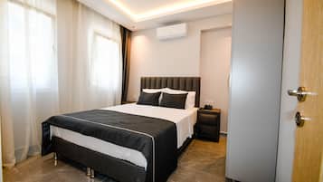 Suíte | Roupas de cama premium, frigobar, cofres nos quartos, cortinas blackout